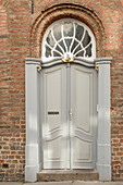  Cream-colored old front door 