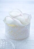 Jewellery box with white rose petals
