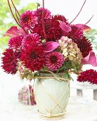 Arrangement of summer flowers in ceramic vase