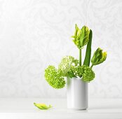 Vase of hydrangeas and tulips