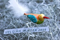 Coloured glass bird with New Year greeting on Calocephalus