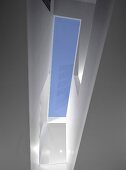 A view of a skylight in a modern, newly built house