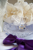 Wedding accessories: a ring holder and silk flowers