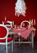 A table laid fro Christmas dinner with designer lamps