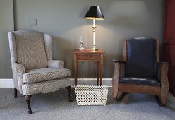 Two armchairs and a side table with a lamp