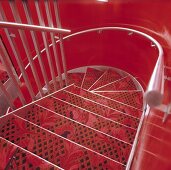 A red stairway - metal stairs covered with a red carpet