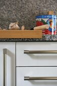 Wooden chopping board on kitchen worktop