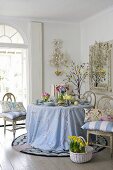Spring flowers and Easter eggs on table