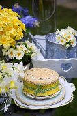A decorated cake and spring flowers