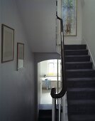 A simple stairwell with a carpet runner