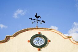 A weather vane on a building