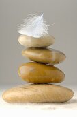 Stacked stones with feather