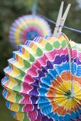 Coloured Chinese lanterns on washing line (garden party decorations)