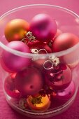 Christmas tree baubles in plastic container