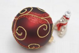 Red Christmas bauble with gold decoration and silver bear
