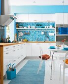 White and turquoise kitchen-dining room