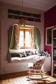 Girl's bedroom with cubby bed & rocking chair