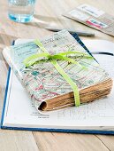 A travel diary covered with a map