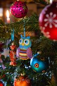 A Christmas tree decorated with a crocheted owl