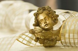 A cherub and ribbon as Christmas decorations