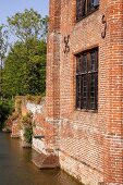 Old brick facade of an English home on the river