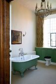 Freestanding bathtub in a vintage look in a traditional bathroom of a country castle