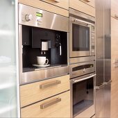 A kitchen with fitted electrical appliances