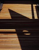 Pattern of light and shade on wooden slats