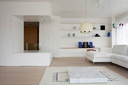 Corner of modern, white living space