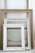 Three picture frames on white surface