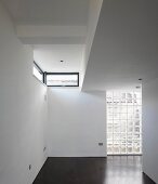 Studio with glass brick wall and narrow windows