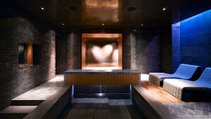 Spa with elegant relaxation area, pool and heart-shaped lighting effect