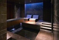 Luxurious spa with relaxation couches and pool