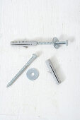 Screws with washers and rawl-plugs