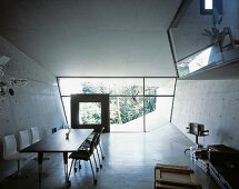A futuristic room with concrete walls and a polished concrete floor