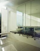 Minimalist designer bathroom with wash basins on dark stone surface