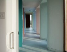 View into corridor with recurrent wave-shaped wall