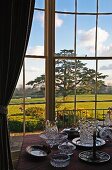 View of grounds of English manor house from dining room