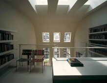 Private library with desk on upper storey