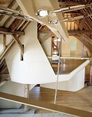 Deconstructivist installations in historic roof structure of converted house