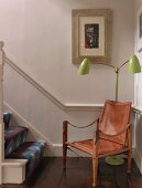 Leather chair and 50s-style standard lamp with green-painted metal shades