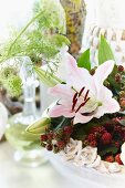 Summery flower bouquet with lilies and blackberries