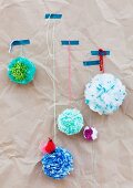 Pompoms made from plastic bags as wall decorations
