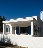 White Mediterranean house below a blue sky
