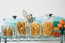 Pots and storage containers for pasta on a shelf