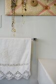 Towel with lace on towel rack