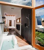 Master bathroom and bedroom in modern eco friendly home