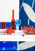 Table set in shades of red & blue (detail)