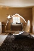 Designer chair in front of window niche shaped like a Reuleaux triangle