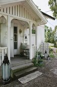 Idyllic wooden lodge with small veranda